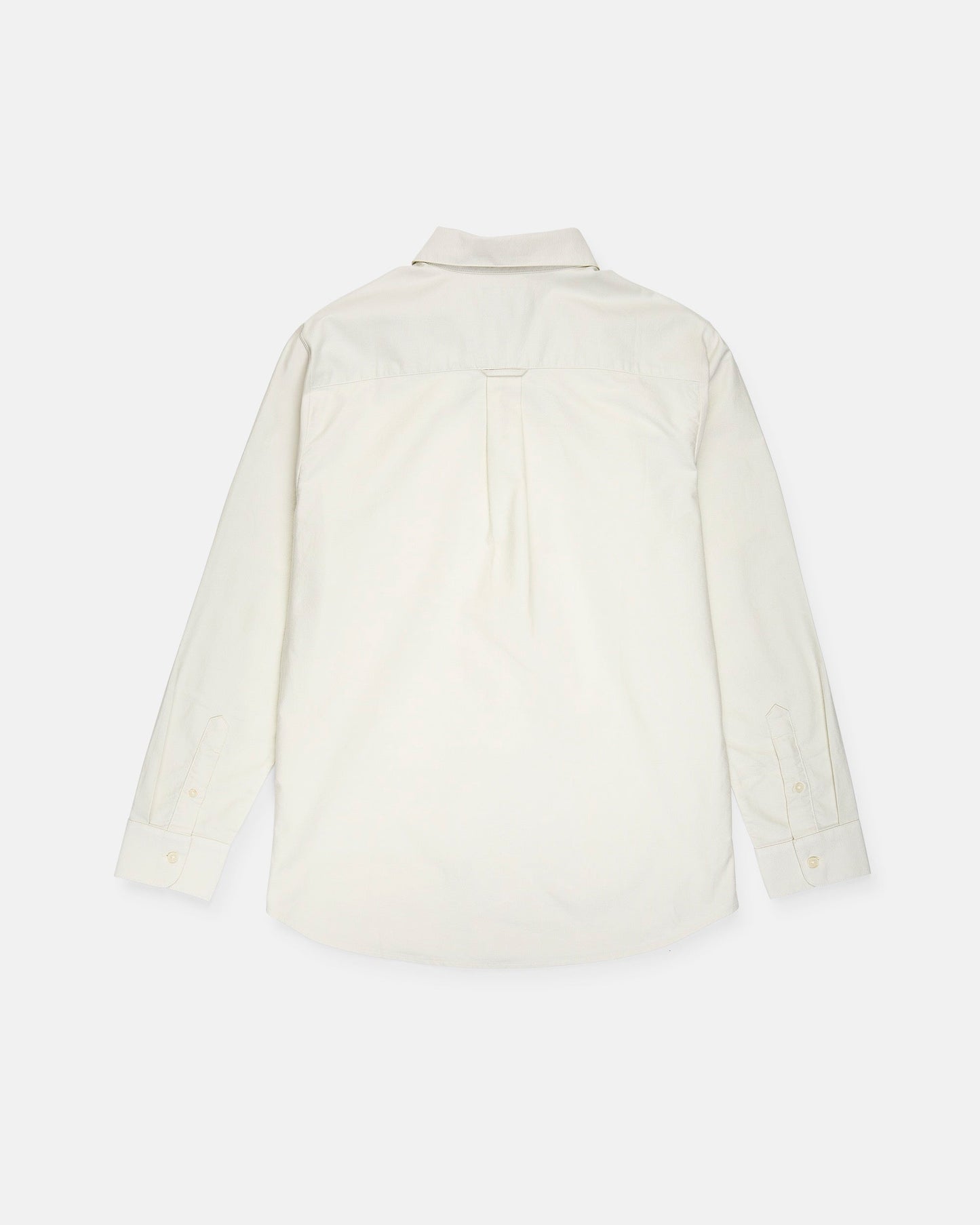 A men's Veeco Oxford Long Sleeve Shirt by Volcom is displayed laid flat with the back side facing up. This white button-up shirt features a classic fit, a collar, a back yoke with a center pleat, and buttoned cuffs.