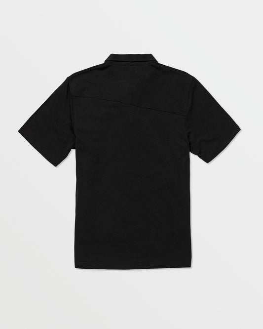 The Volcom Kids' Wowzer Polo Short Sleeve Tee, a plain black modern fit shirt, is displayed from the back and laid flat on a white background.