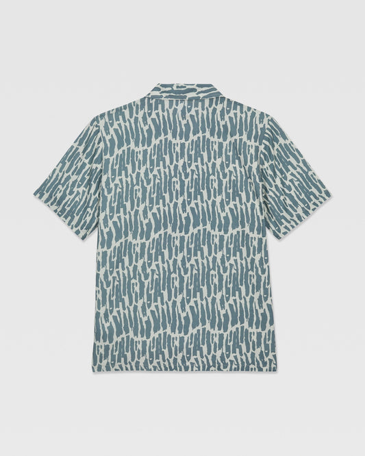 The Volcom Kids' Boldstone Short Sleeve Tee features a blue and white abstract brushstroke pattern, shown flat from the back.