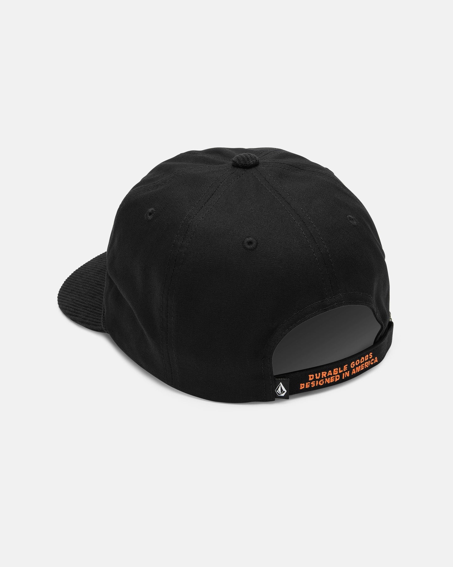 A rear view of the Volcom Men's Stone Talon Workwear Hat—a black canvas 5-panel baseball cap—shows its fabric strap, which is accented by a small orange tag with the text "DURABLE GOODS DESIGNED IN AMERICA" in capital letters.