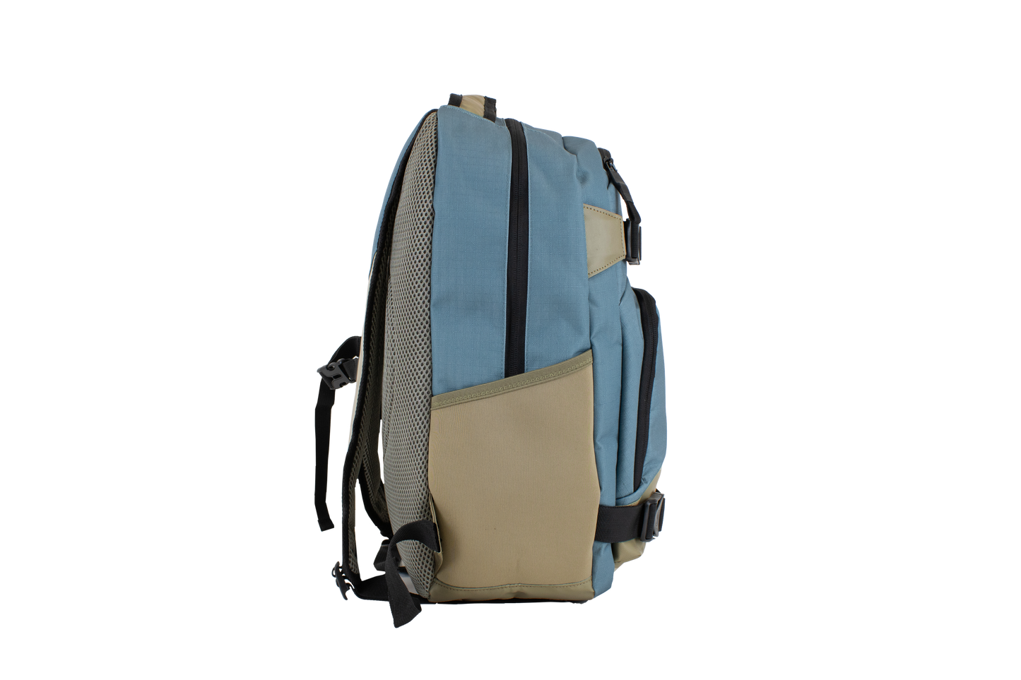 The Volcom Men's Grindstone Skate Backpack in blue and tan is displayed from the side on a plain white background, highlighting its ergonomic straps, mesh pocket, and zipper.