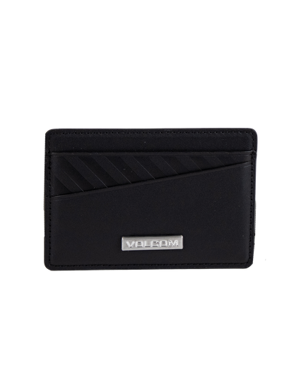 The Volcom Men's Primo Dos Cardholder features a sleek black design with diagonal textured lines on the top left and is accented by a silver metal plate engraved with "VOLCOM" at the bottom center, displayed against a plain white background.