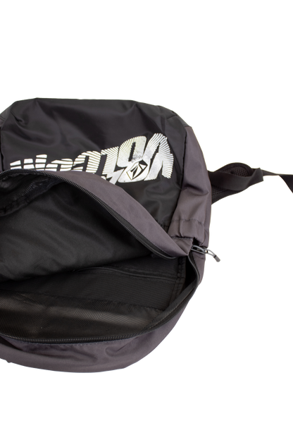 A black Volcom Men's Summer School backpack with a partially open zipper reveals its empty interior. This lightweight backpack features bold white graphic text on the front and includes a convenient laptop sleeve for easy organization.