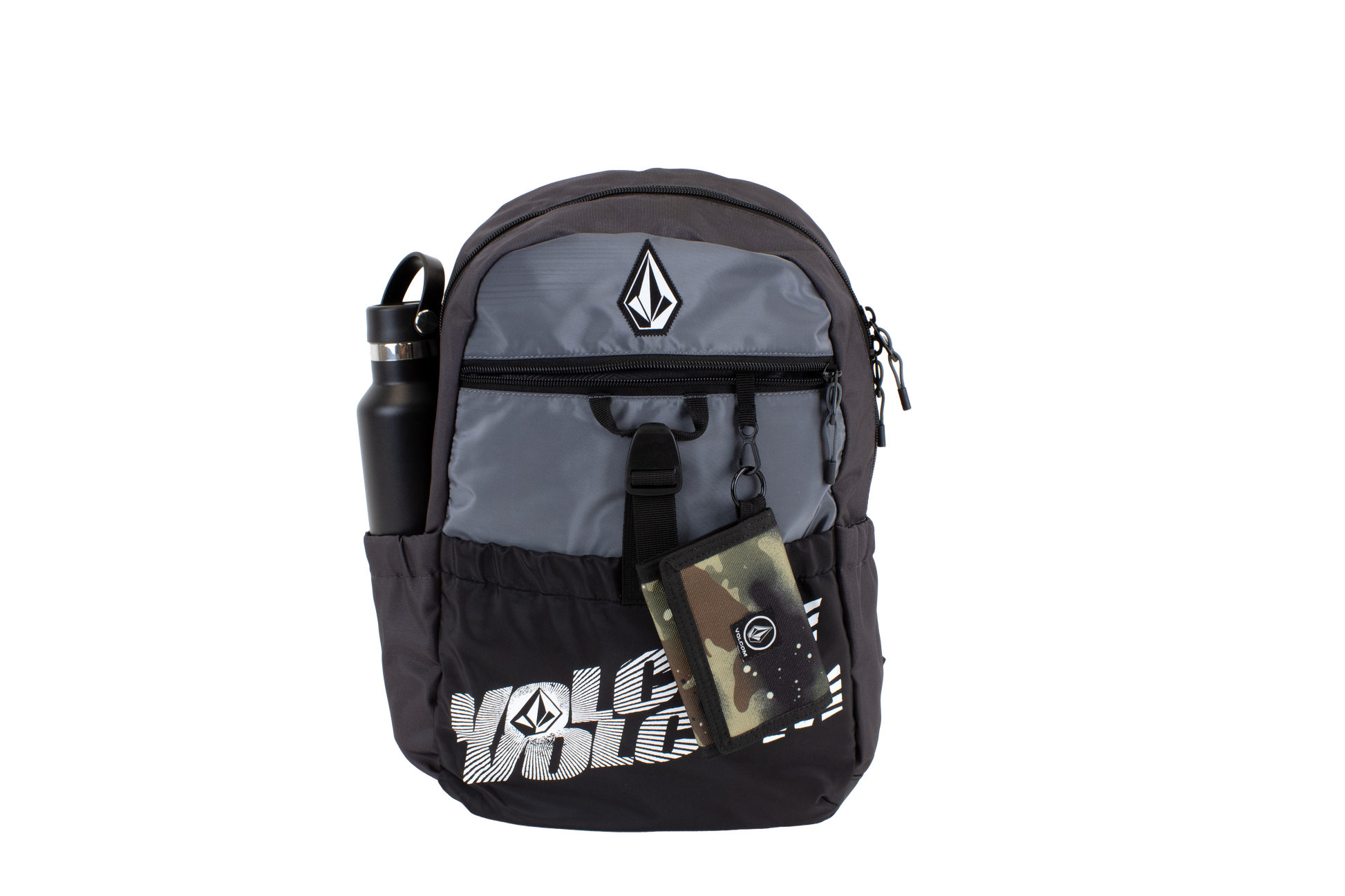The Volcom Men's Summer School backpack features a sleek black and gray design with the brand’s logo and signature Stone printed on the front. It includes a front zipper pocket, a dedicated laptop sleeve, and side pocket that holds a black water bottle. A camo wallet is attached to the zipper. Lightweight and practical, this Volcom Men’s Summer School backpack makes the perfect choice for your summer school essentials.