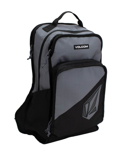 The Men's Boundary Backpack by Volcom is a gray and black bag featuring two front zippered compartments, a top handle, and the Volcom logo on the lower pocket.