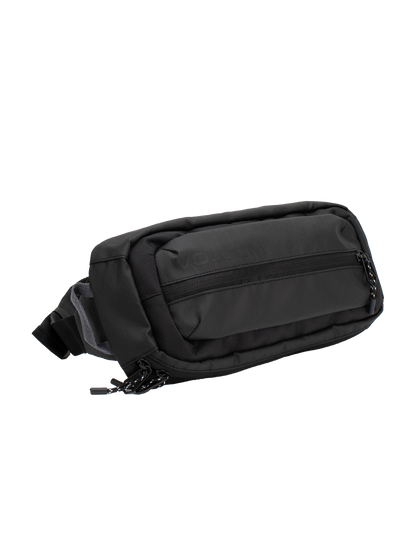 A Men's Venture Light Sling Pack by Volcom in black, featuring a front zipper pocket and an adjustable strap, is displayed on a plain white background. This lightweight Volcom sling pack offers a stylish and convenient way to carry your essentials.