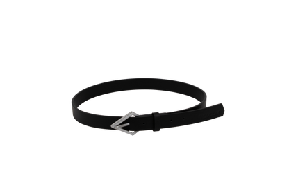 The Volcom Women's Stoned Forever black leather belt, featuring a distinctive silver, stone-shaped buckle, is coiled in a circle on a plain white background.
