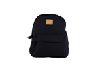 The Volcom Women's Winnie Backpack is a black mini backpack featuring a front zipper pocket and a tan square logo patch on the upper front, ideal for carrying your everyday essentials, shown against a plain white background.
