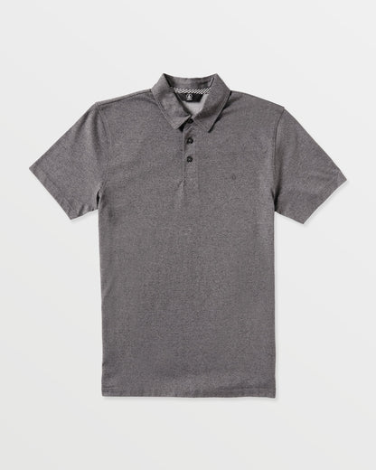 The Volcom Men's Wowzer Polo Short Sleeve Shirt features a classic collar and three black buttons in plain gray, offering a modern fit perfect for business casual style.