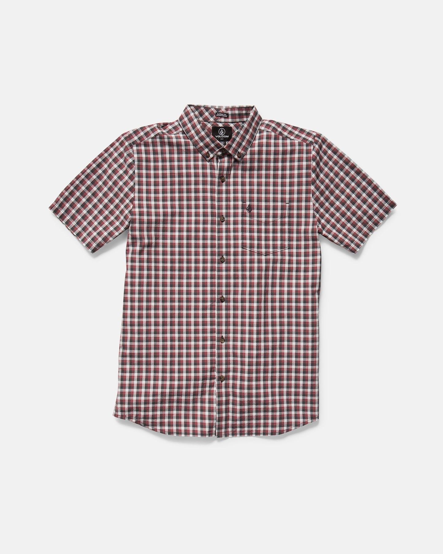 The Volcom Men's Louie Check Short Sleeve Tee features a red, white, and black plaid pattern with hints of light blue acid check, shown on a plain white background.