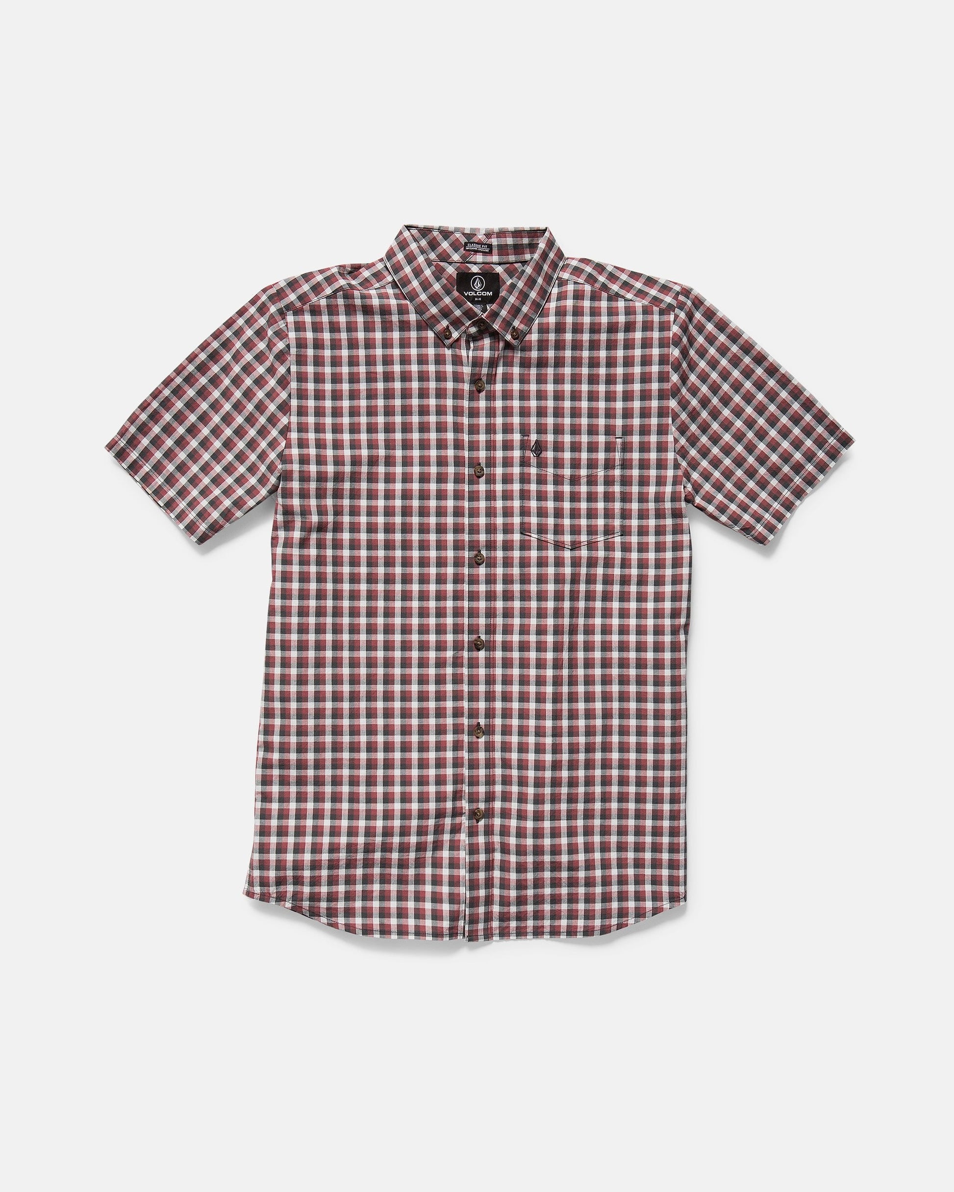 The Volcom Men's Louie Check Short Sleeve Tee features a red, white, and black plaid pattern with hints of light blue acid check, shown on a plain white background.