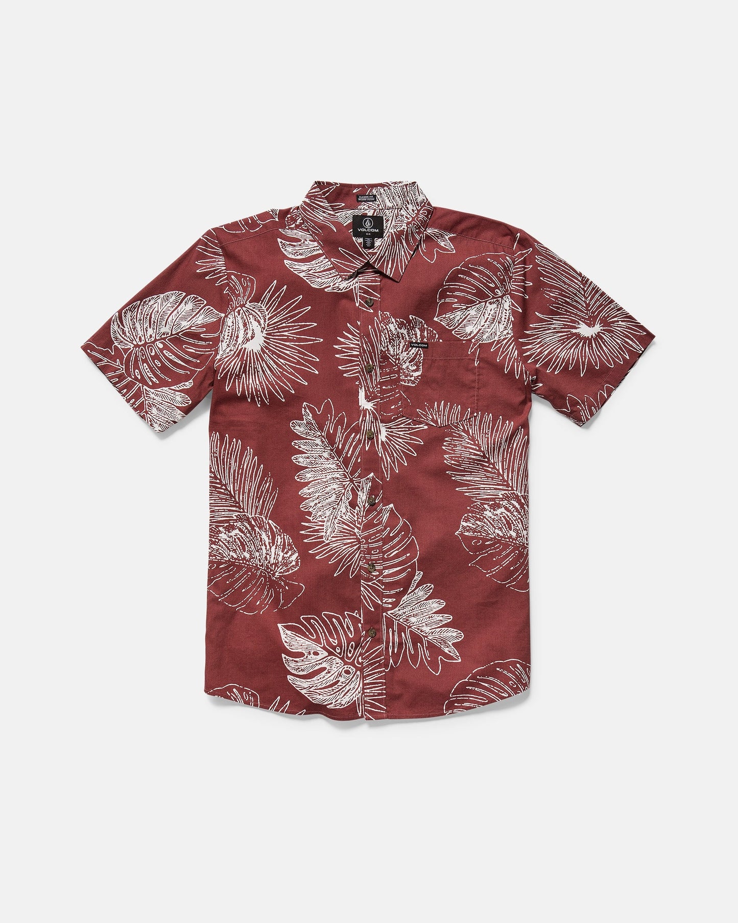 The Volcom Men's Monsterious Short Sleeve Shirt features a button-up design, collar, chest pocket, and white tropical leaf print on burgundy, made from a comfy cotton-viscose blend.