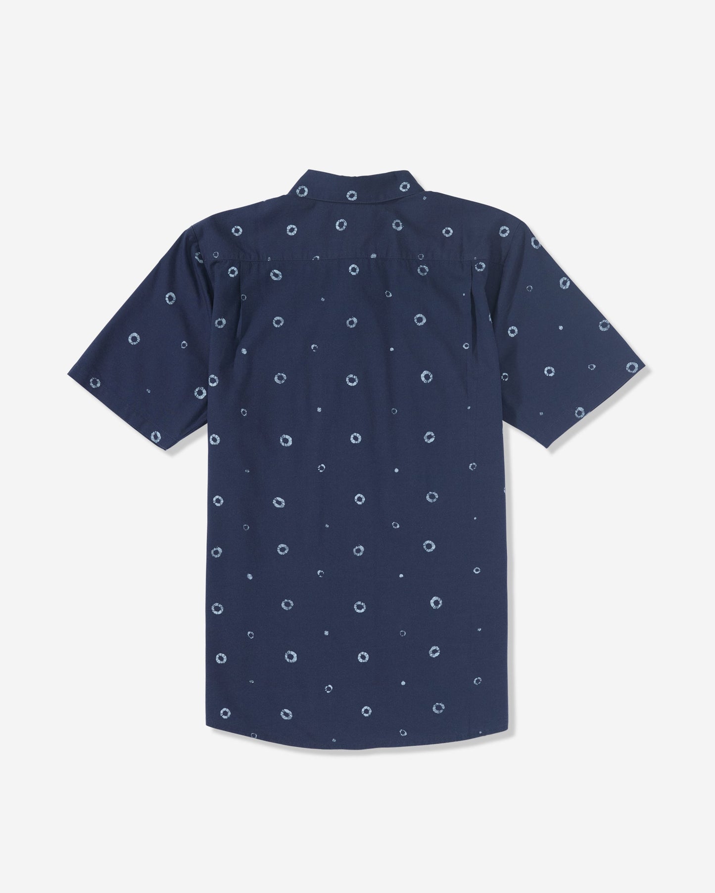 The Men’s Scaler Stone Woven Short Sleeve Shirt by Volcom is a navy blue collared shirt with an allover print of small white circular dots, shown from the back.