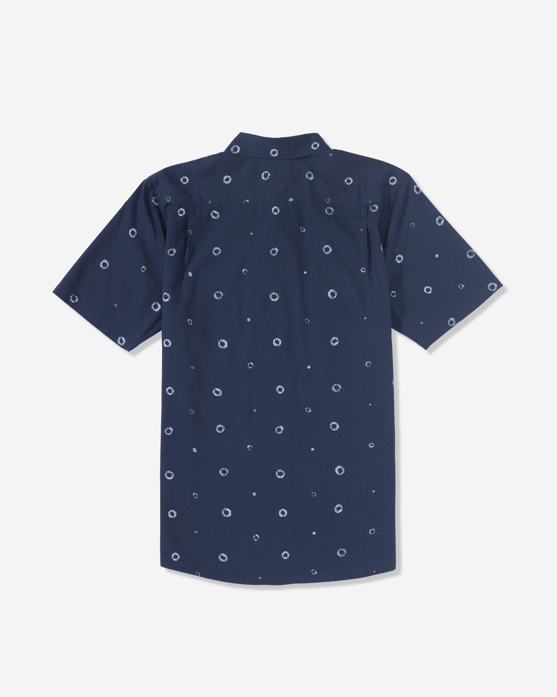 The Men’s Scaler Stone Woven Short Sleeve Shirt by Volcom is a navy blue collared shirt with an allover print of small white circular dots, shown from the back.