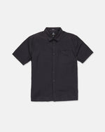 The Volcom Men's Glasnow Short Sleeve Shirt, shown laid flat on a white background, features a black cotton fabric with a subtle small yarn-dyed checkered pattern, button-up front, flat collar, and chest pocket.