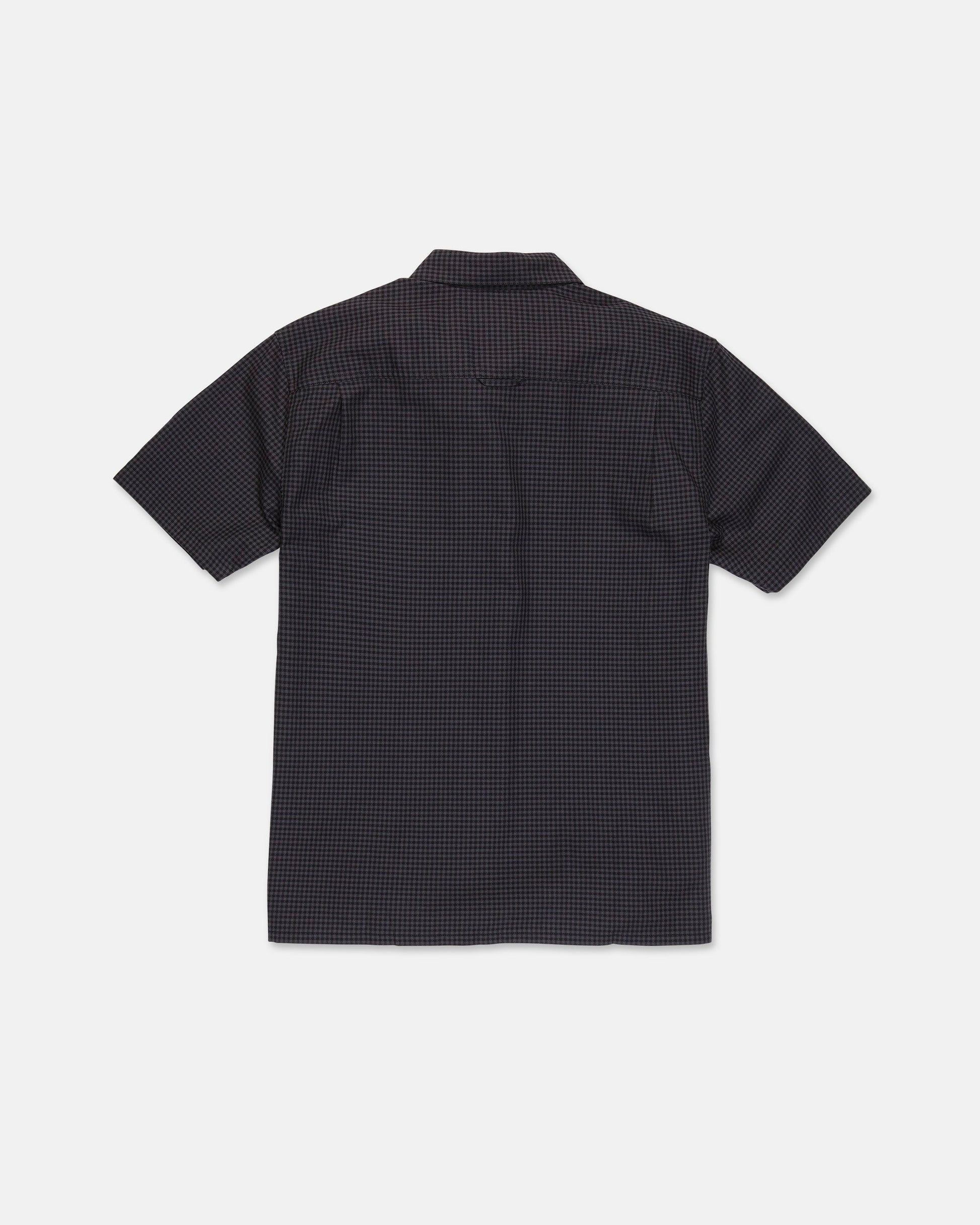 A Volcom Men's Glasnow Short Sleeve Shirt, featuring a small yarn-dyed checkered pattern in dark colors and made from cotton, is laid flat with the back side visible against a white background.