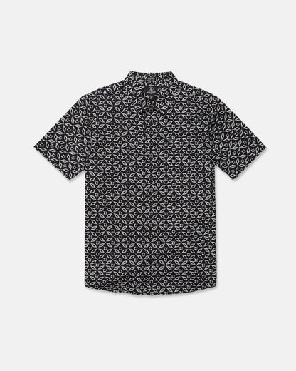 The Volcom Men's Scaler Stone Short Sleeve Shirt features a black color with a white geometric print and is shown laid flat on a white background.