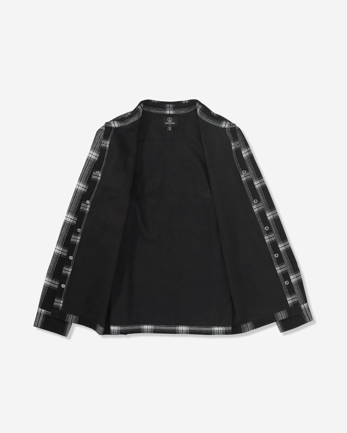 The Volcom Men's Wilderstone Long Sleeve is a black shirt with an open front, featuring black and white plaid accents along the edges and inner sleeves. Shirt is displayed laid flat on a white background.