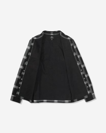 The Volcom Men's Wilderstone Long Sleeve is a black shirt with an open front, featuring black and white plaid accents along the edges and inner sleeves. Shirt is displayed laid flat on a white background.