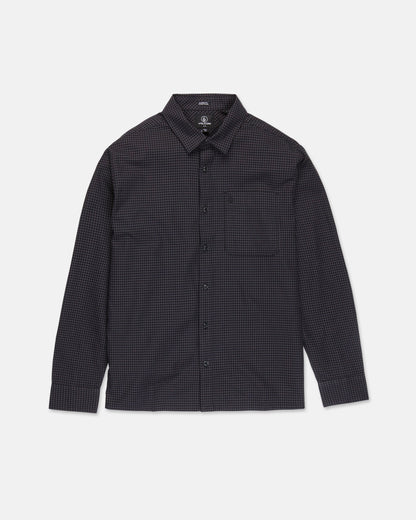 The Volcom Men's Glasnow Long Sleeve Shirt is a button-up, boxy fit style featuring a small black and dark blue checkered pattern, collar, and chest pocket. Crafted from yarn-dyed dobby texture fabric, it is shown laid flat against a white background.