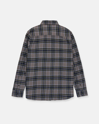The Volcom Men's Caden Plaid Long Sleeve Shirt is a classic fit button-up flannel featuring a black, blue, and gray plaid pattern. Shown from the back against a white background, it is crafted from soft cotton flannel for lasting comfort and durability.