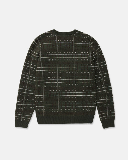 The Volcom Men's Stone Optix Sweater is a dark green slim fit crew neck sweater featuring a white and light green grid pattern with small dotted accents. Shown laid flat with the back facing up, this modern design offers a distinctive look.