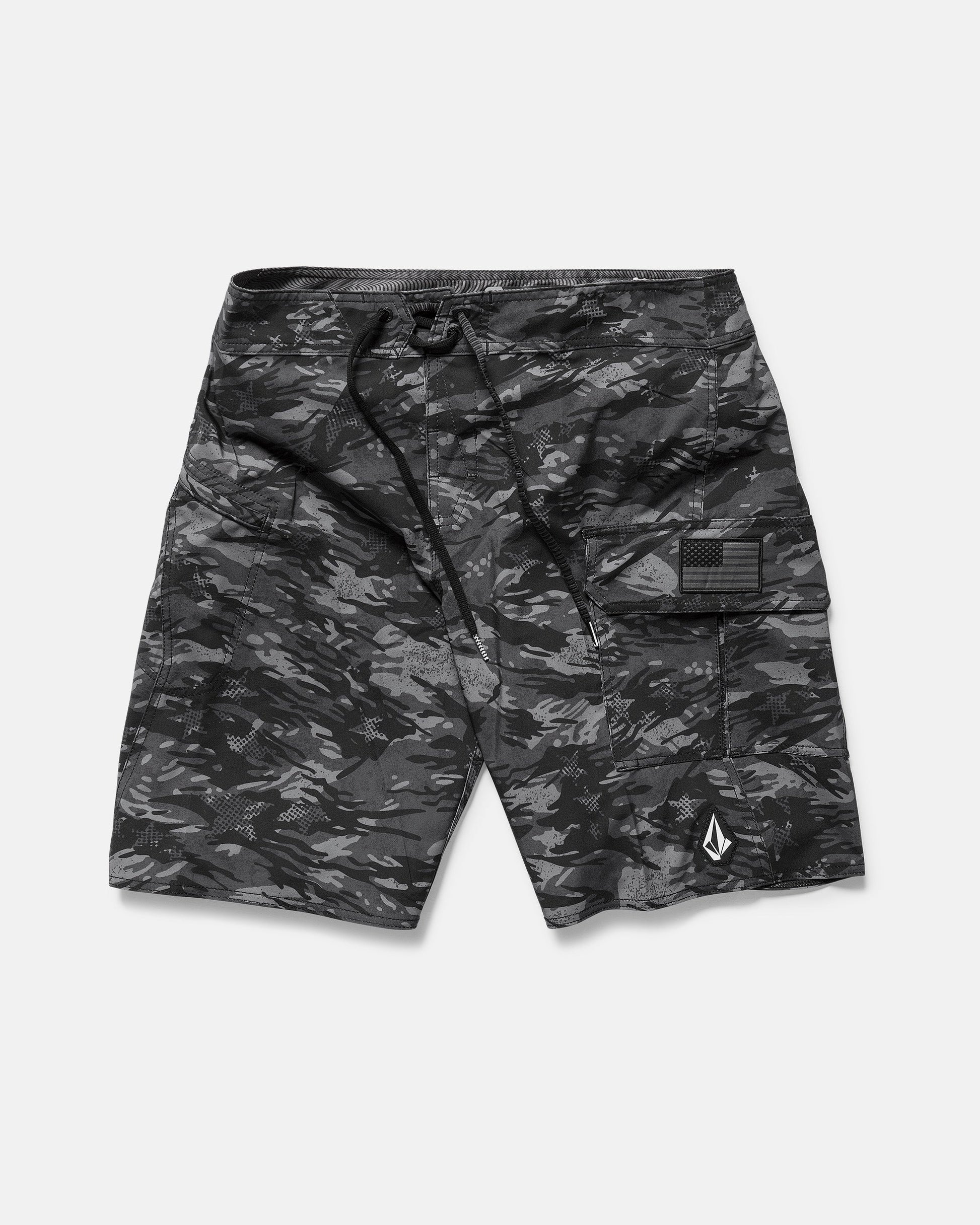 The Volcom Men's 4th Of July Preemo Mod boardshort features black and gray camouflage, Cinch Fly Technology, a drawstring waistband, side cargo pocket, and a small white geometric logo near the hem, shown flat on a white background.