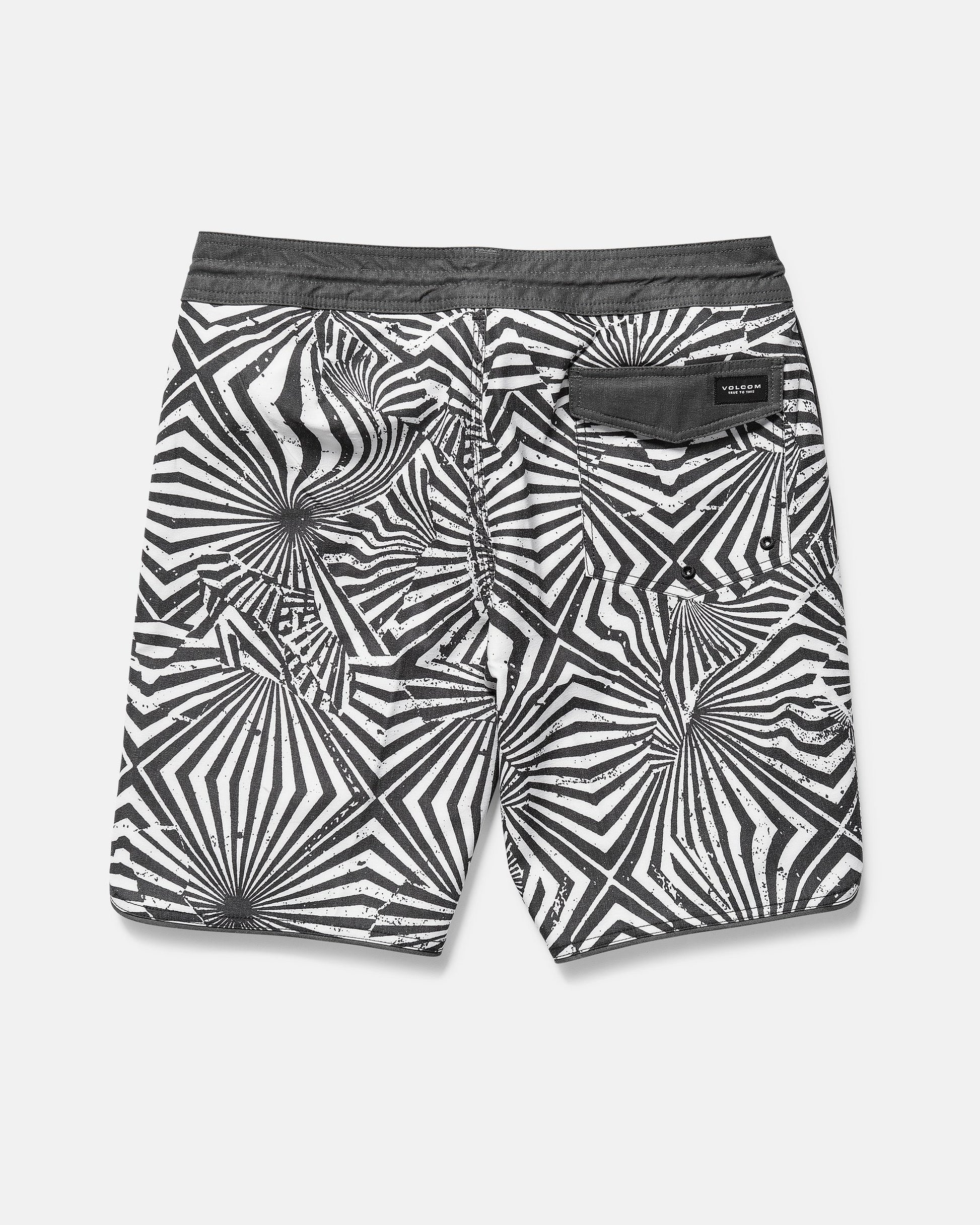 Black and white patterned shorts on a gray background