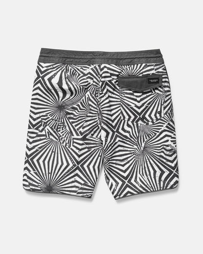 Black and white patterned shorts on a gray background