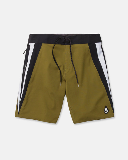 Men's Facet Mod board shorts by Volcom in olive green, featuring black and white side panels, a black waistband with matching drawstring, and a small logo patch on the lower left leg. Crafted from 4-way stretch Mod-Tech fabric for optimal comfort and flexibility, these Y2K-inspired shorts are shown laid flat on a white background.