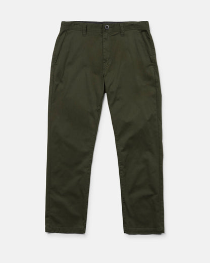 A pair of Volcom Men's Frickin Modern Stretch Pants in olive green, featuring a straight-leg cut with side pockets, front button closure, and zip fly. Crafted from REPREVE recycled fibers for sustainability, these modern stretch chino pants are displayed flat against a white background.