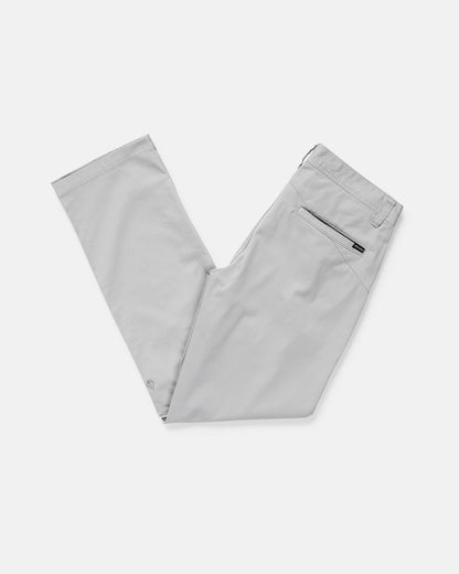 Light gray dress pants neatly folded in half, displayed against a plain white background. The pants feature back pockets, one with a zipper, and belt loops at the waistband.