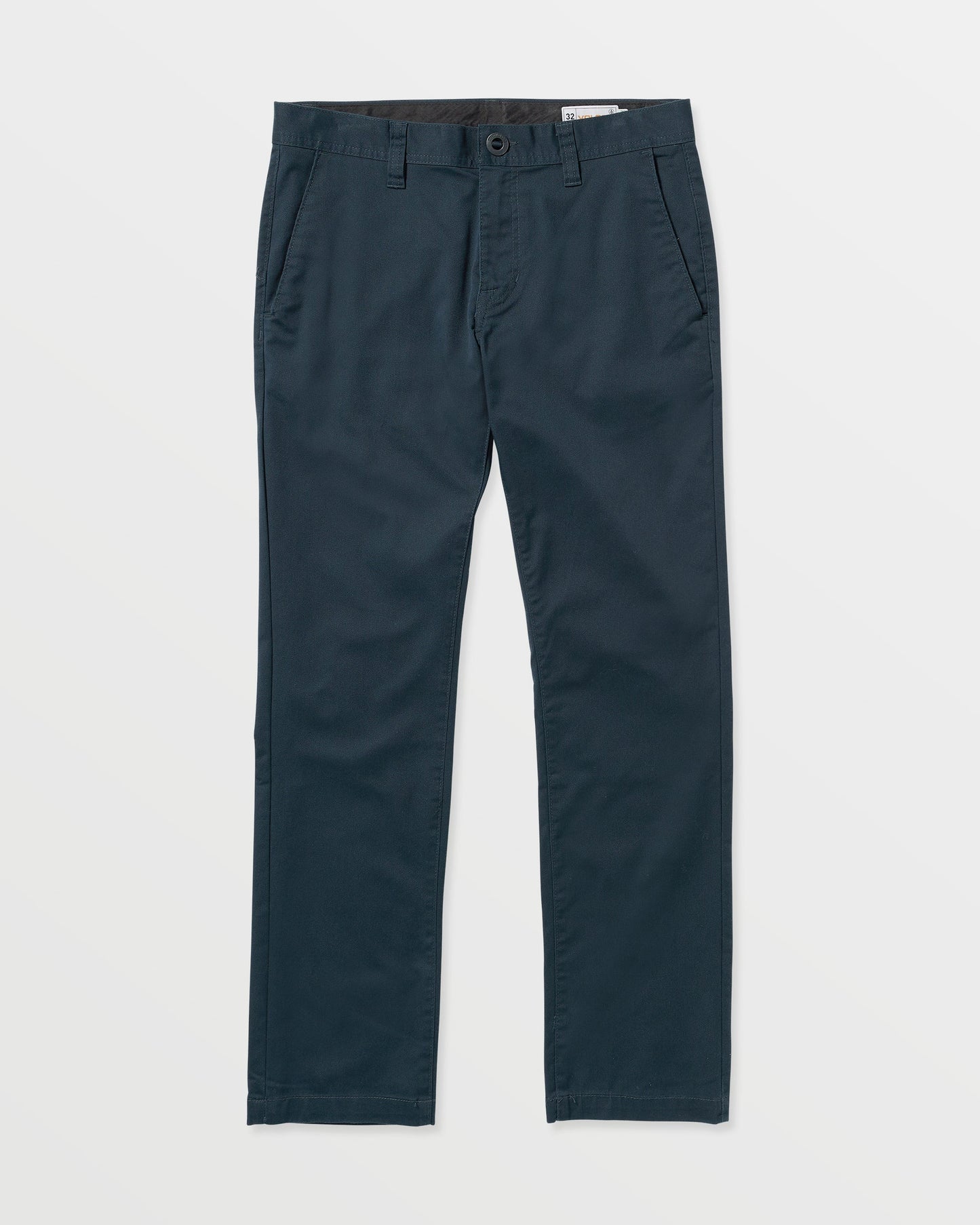 The Volcom Men's Frickin Modern Stretch Pants are slim-fit dark navy blue twill pants with side pockets, button and zip closure, and belt loops, shown on a white background.