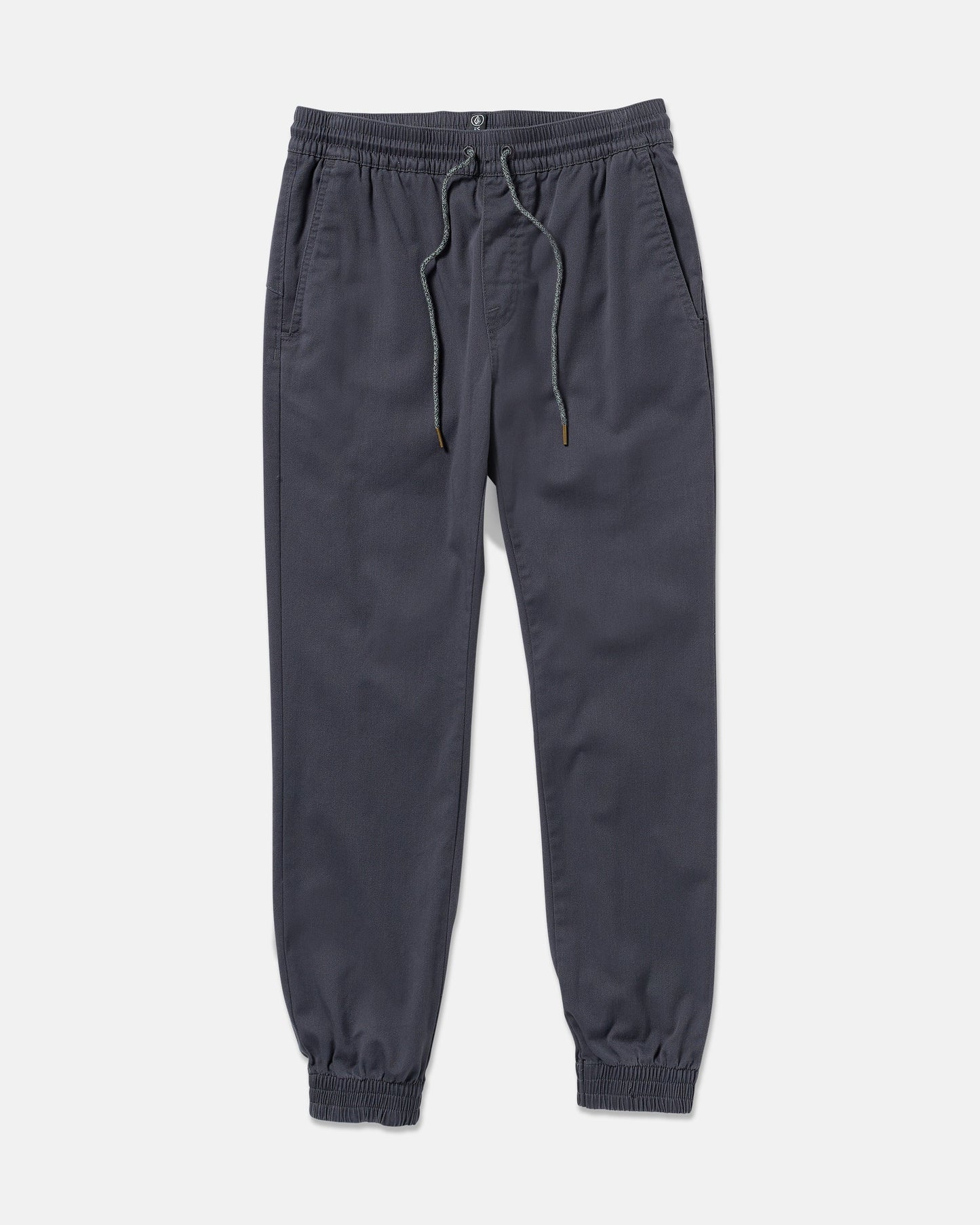 The Volcom Men's Frickin Slim Joggers in dark gray feature REPREVE recycled fibers, an elastic waistband with drawstring, side pockets, and elastic cuffs, shown laid flat on a white background.