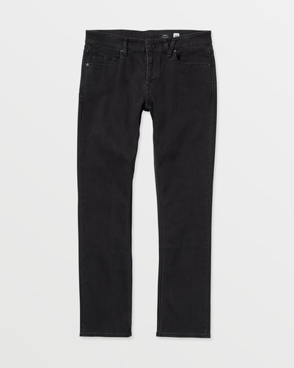 The Volcom Vorta Denim features a classic five-pocket design in black stretch denim with a slim, straight-leg fit, shown laid flat on a white background.