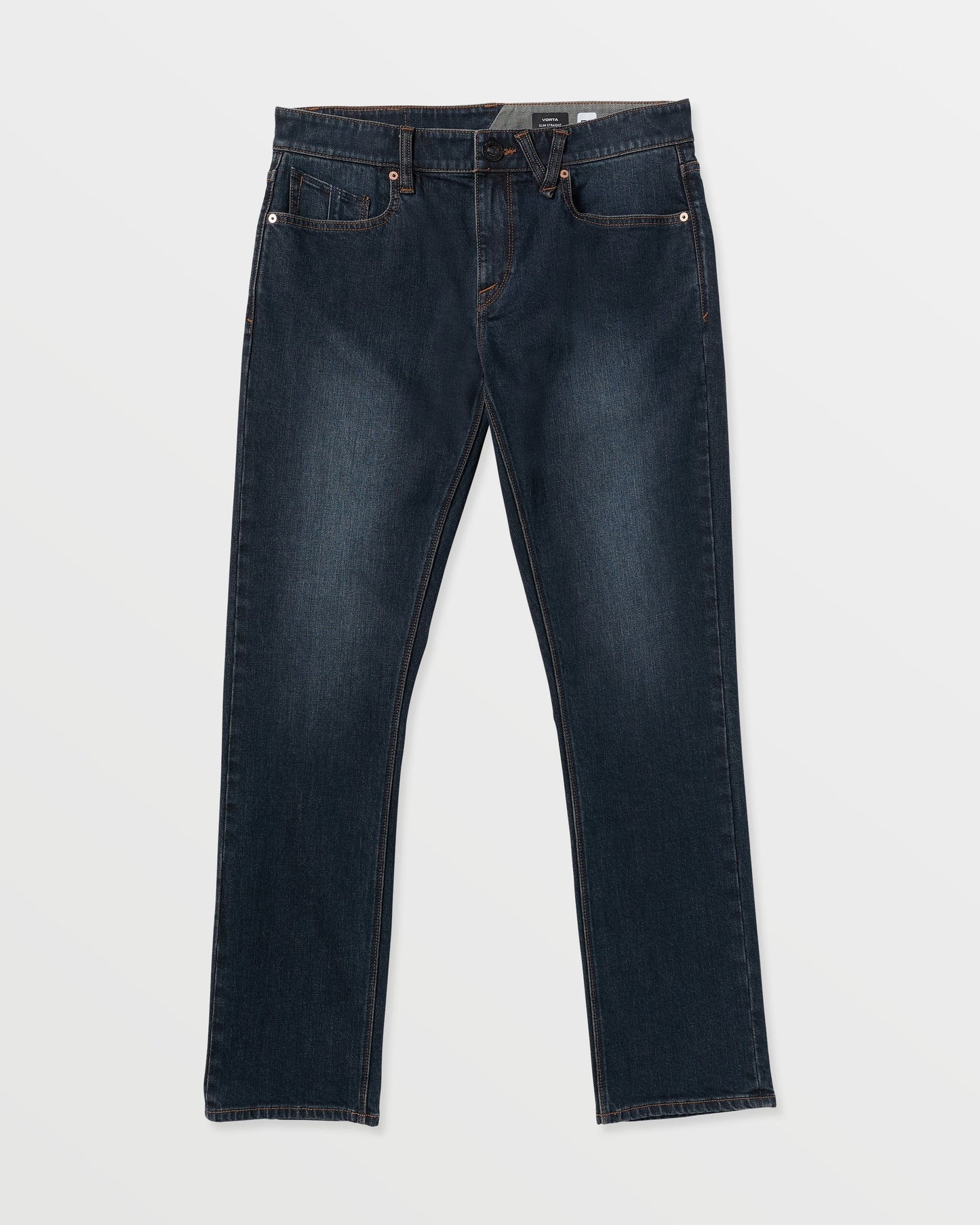 The Volcom Men's Vorta Denim features dark blue straight-leg jeans with classic five-pocket styling, visible stitching, and a button closure, shown laid flat on a white background.