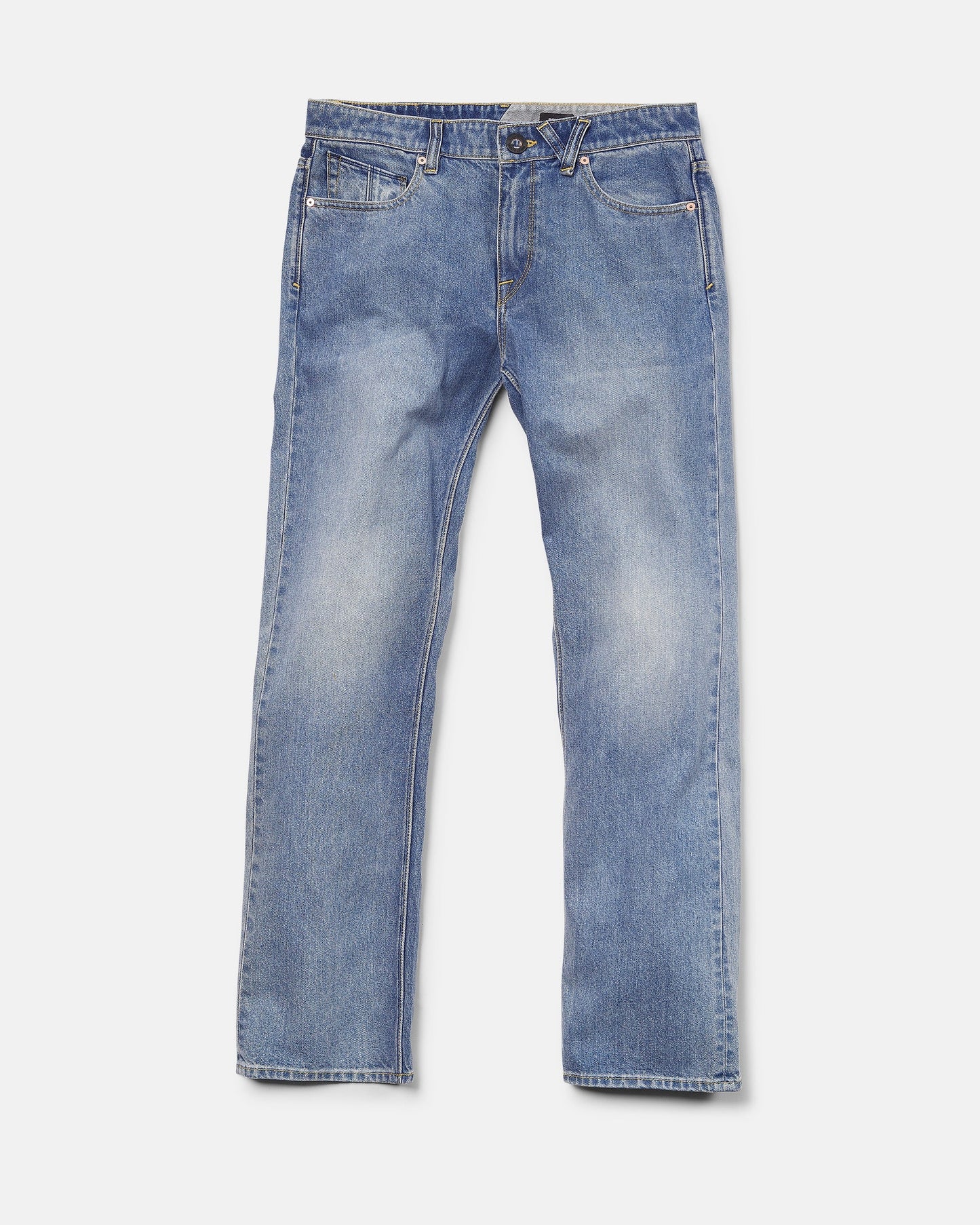 A pair of Volcom Men's Solver Denim Pants in Freedom Blue, featuring a modern straight leg cut, crafted from soft stretch denim with front pockets, belt loops, and a button closure, laid flat on a white background.