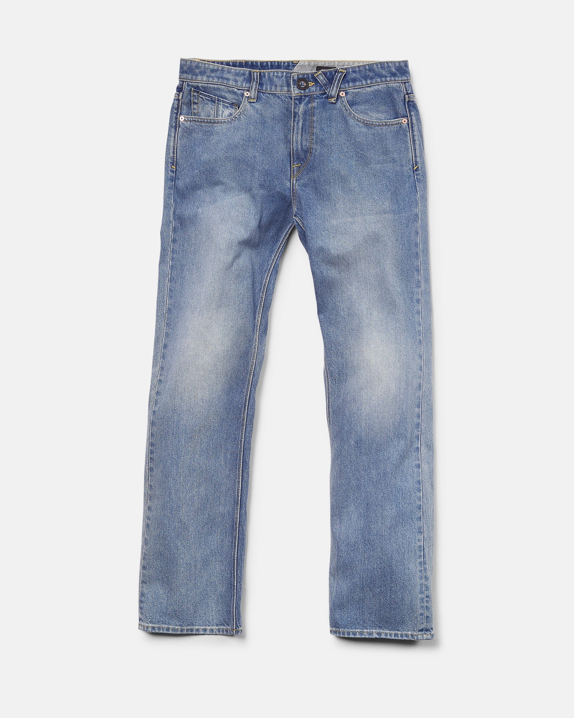 A pair of Volcom Men's Solver Denim Pants in Freedom Blue, featuring a modern straight leg cut, crafted from soft stretch denim with front pockets, belt loops, and a button closure, laid flat on a white background.
