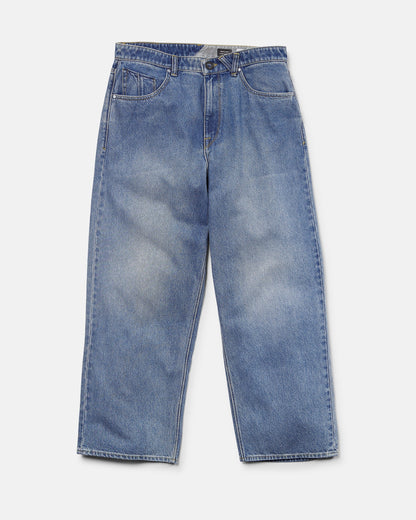 Presenting the Volcom Men's Chillow Denim Pants in Euro Light Blue—these relaxed, wide-leg jeans feature front pockets and a button closure, laid flat on a white background. With their baggy low-rise fit, the Chillow Denim Pants deliver effortless style and comfort to any casual wardrobe.