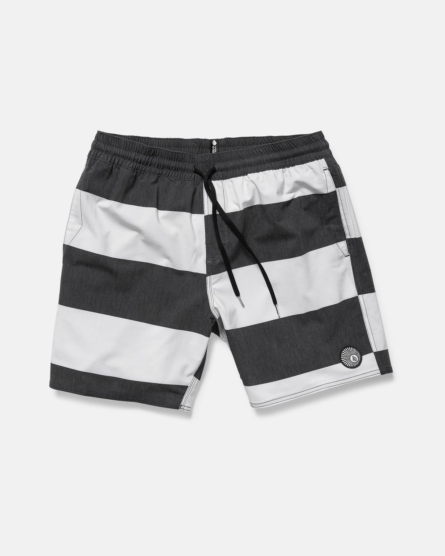 The Volcom Men's Psyche Cotton 17" Trunk features wide black and white stripes, an elastic waistband with black drawstring, side pockets, a logo on the left leg, and a classic 17-inch outseam.