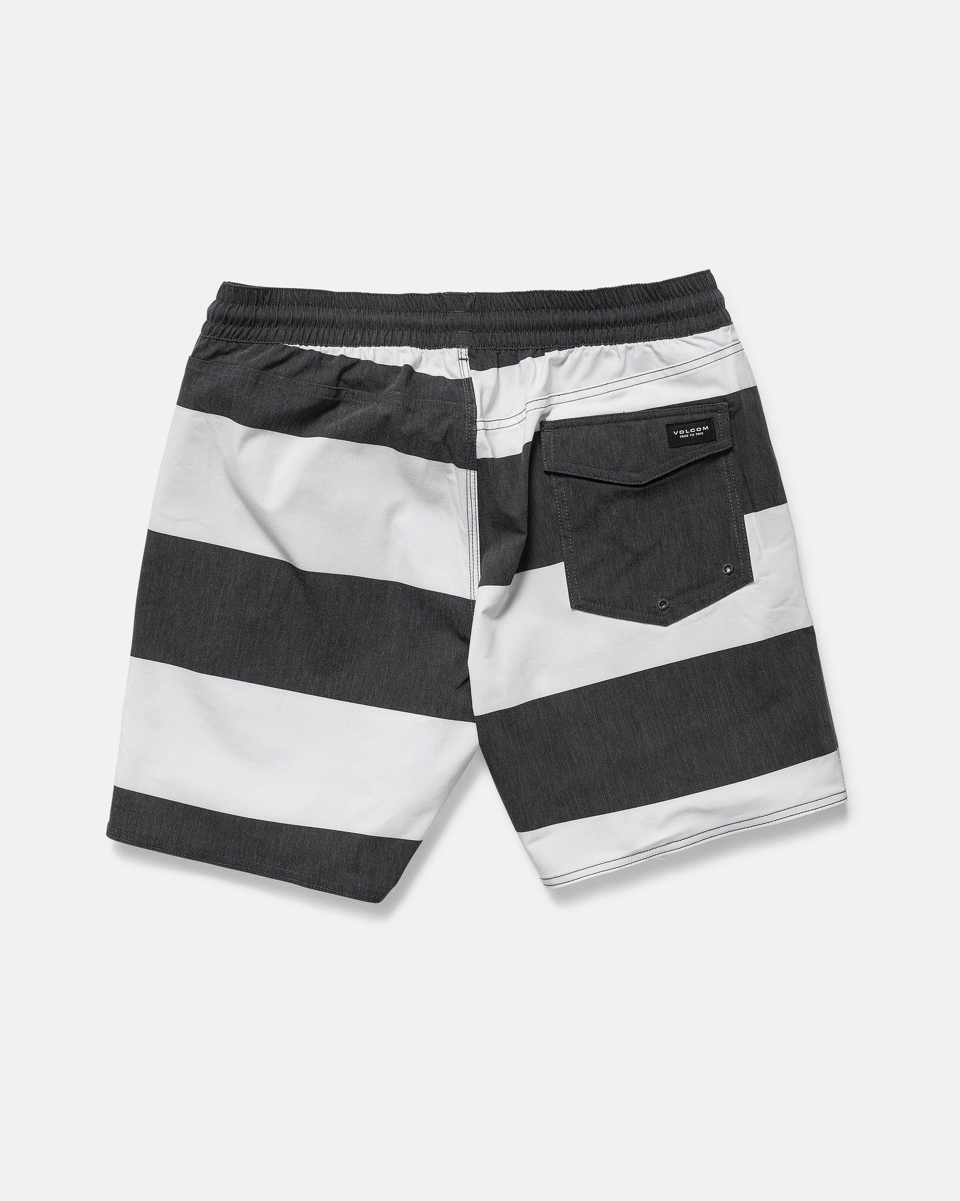 Back view of Volcom Men's Psyche Cotton 17" Trunk in black and white horizontal stripes, featuring a 17-inch outseam, elastic waistband, and a single flap back pocket on the right.