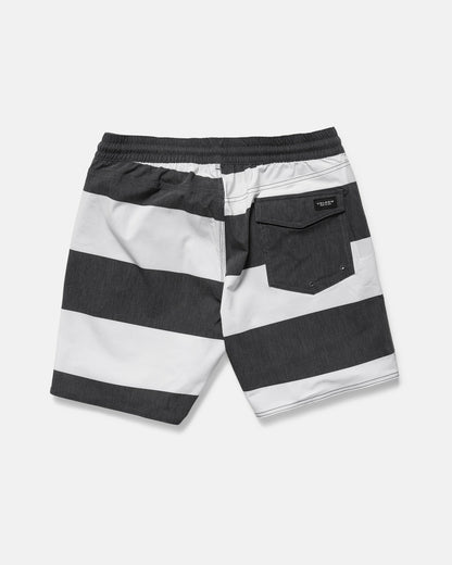 Back view of Volcom Men's Psyche Cotton 17" Trunk in black and white horizontal stripes, featuring a 17-inch outseam, elastic waistband, and a single flap back pocket on the right.