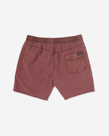Back view of Volcom Men's Center Elastic Waist Trunks in maroon, featuring an elastic waist, right back pocket with a black label above it. Made from a polyester blend and shown laid flat on a white background.
