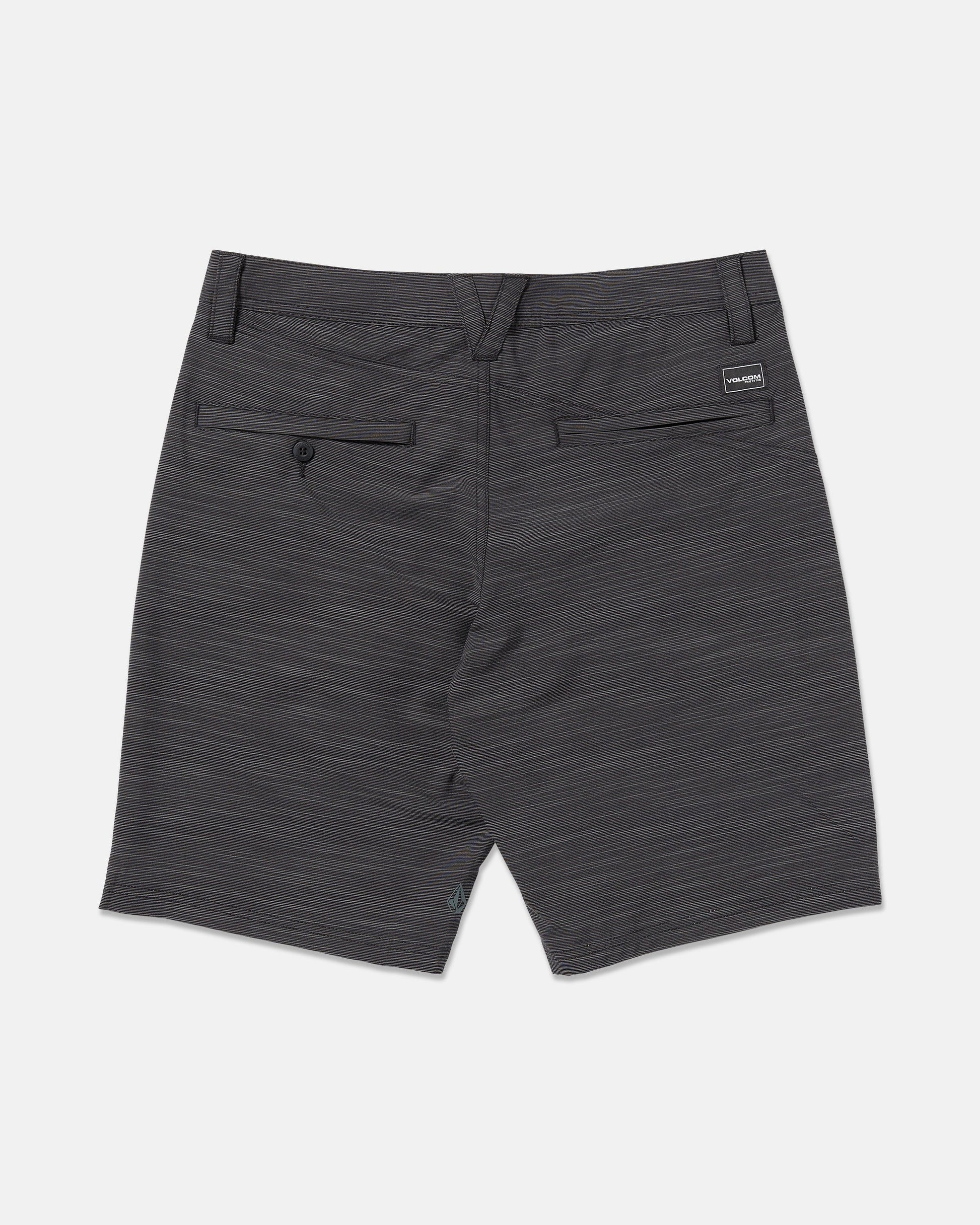 A pair of Volcom Men's Slub Frickin Cross Shred 20" Hybrid Shorts in dark gray shown from the back, featuring 4-way stretch, two back pockets (one with a button), and a small rectangular Volcom label above the right pocket.