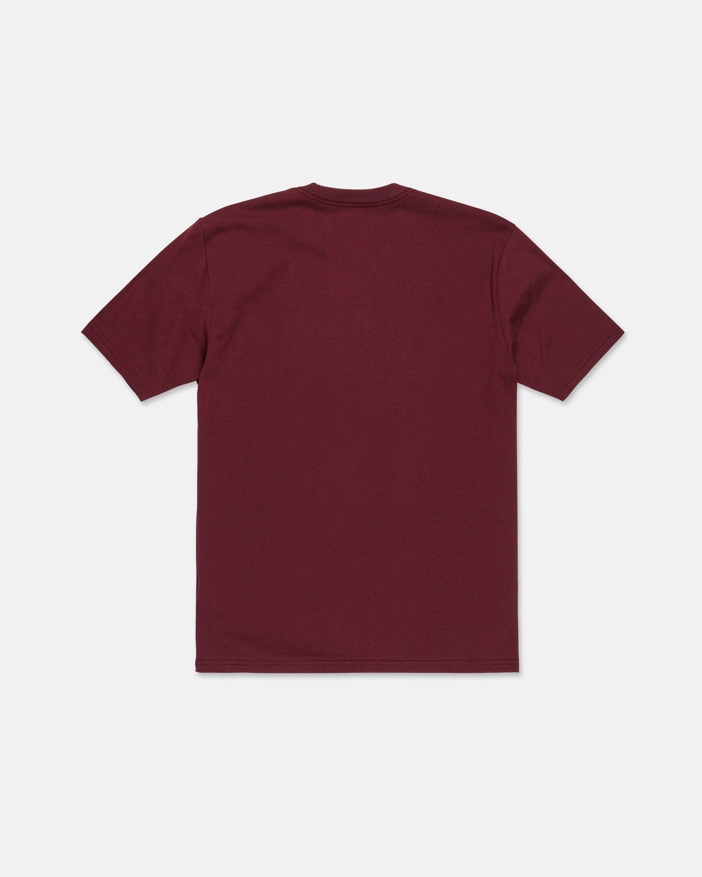 The Volcom Men's Wave Stone Short Sleeve Tee is shown laid flat with the back side facing up against a white background. This premium t-shirt is made from high-quality ring spun cotton and features a plain maroon color.