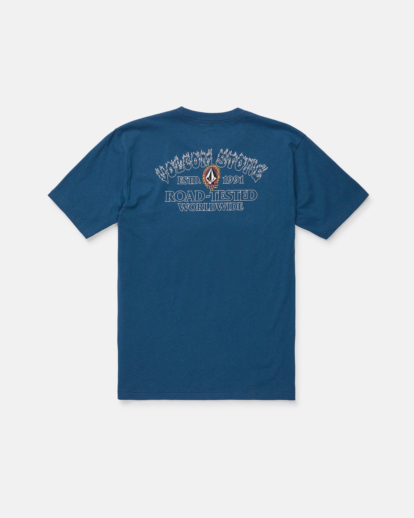 The Volcom Men's Ringafire Short Sleeve Tee, shown from the back in blue, is crafted from premium ring spun cotton for a soft, durable feel. This heavy-weight t-shirt features decorative white and blue "Road-Tested Worldwide" text, a small graphic, and additional branding above and below it.