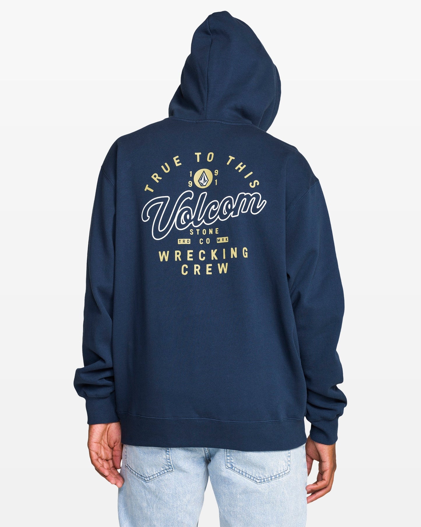 Navy hoodie with Volcom branding on the back against a light gray background