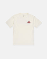 The Men's Helios Short Sleeve Tee by Volcom is a premium, cream-colored, short-sleeve shirt made from 190g cotton for all-day comfort. It features a small red sun graphic and "VOLCOM STONE" text on the left chest and is displayed laid flat on a white background.