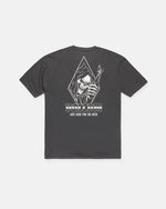 The Men's Fear No Beer Short Sleeve Tee by Volcom is a loose fit black graphic cotton shirt, featuring a white hooded skeleton holding a beer bottle. The design includes the phrases "DEATHWISH," "JUST HERE FOR THE BEER," and "Fear No Beer.