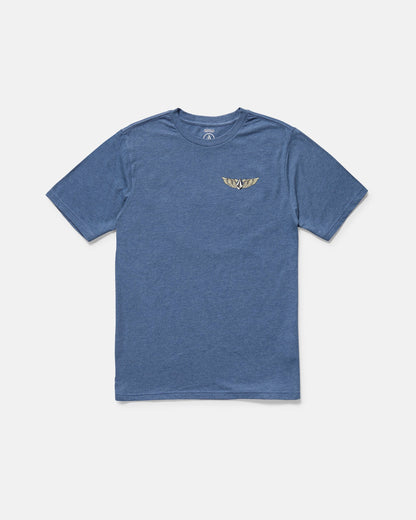 The Volcom Men's Hi Flyer Short Sleeve Tee is a blue modern fit top made from soft ring spun cotton, with a small gold winged emblem on the left chest, shown against a plain white background.